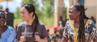 Women within a community in Malawi dance with Columbia Nursing student Karen K. Hsu.